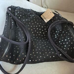 Earthbound Trading drawstring bag made of brown suede and leather